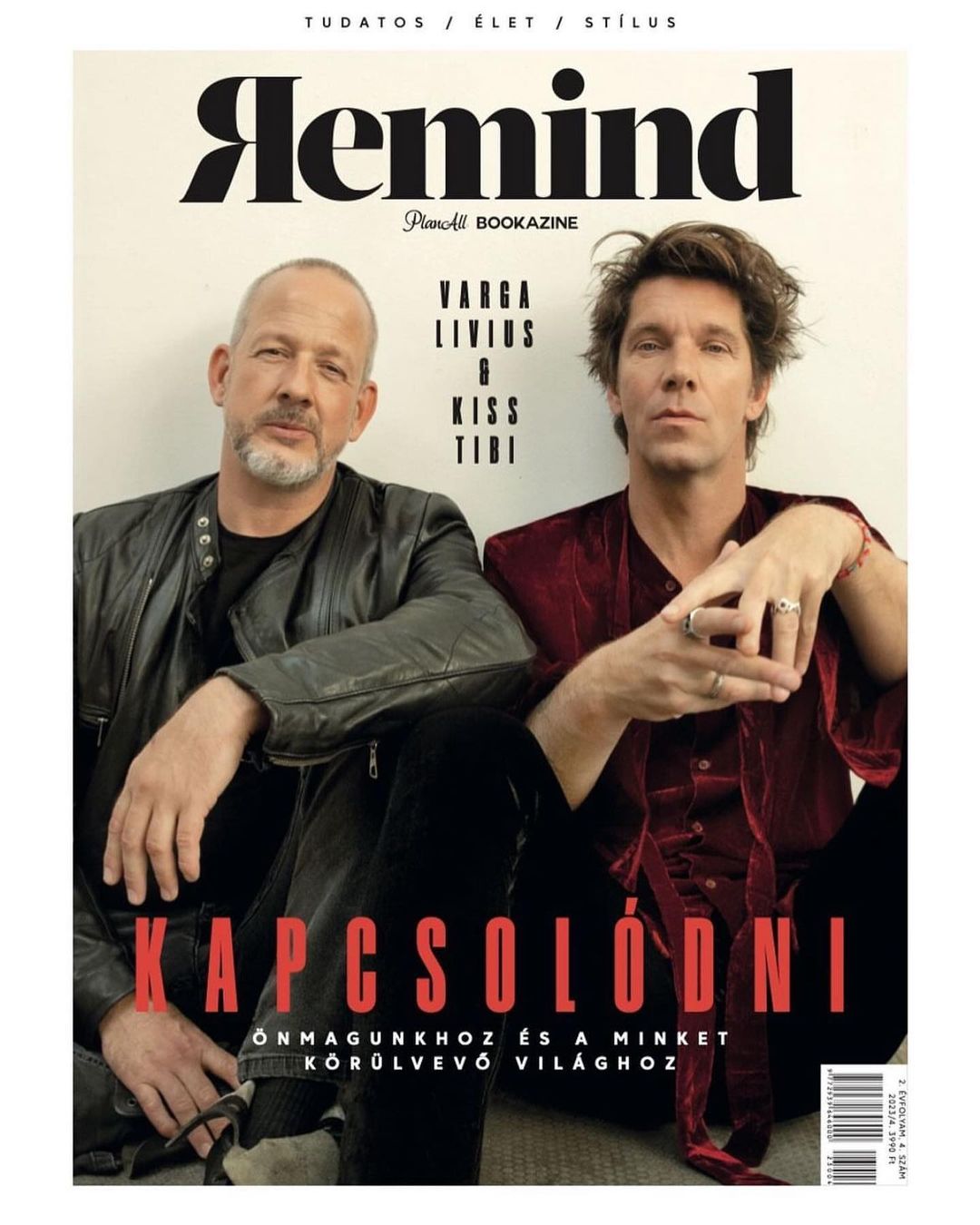 Magazine cover featuring two adult males in a studio setting. One wears a leather jacket; the other is in a velvet top.