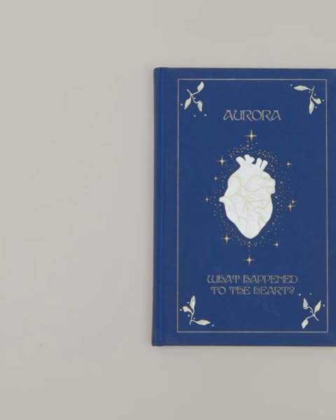 Book cover featuring a stylized anatomical heart surrounded by stars, with the title 'Aurora' and subtitle 'What Happened To The Heart?'