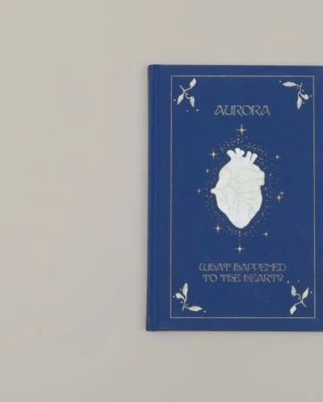 Book cover featuring a stylized anatomical heart surrounded by stars, with the title 'Aurora' and subtitle 'What Happened To The Heart?'