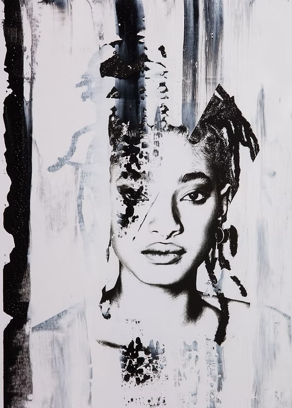 Portrait of a woman with dreadlocks and a serious expression, rendered in black and white with artistic paint strokes and splatters.