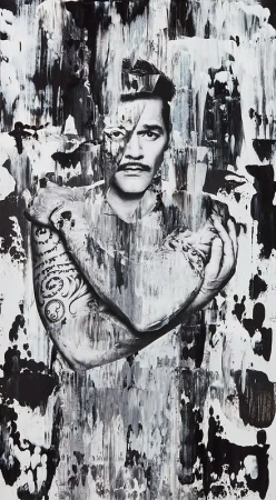 Black and white portrait of a tattooed man with crossed arms against a heavily textured abstract painted background.