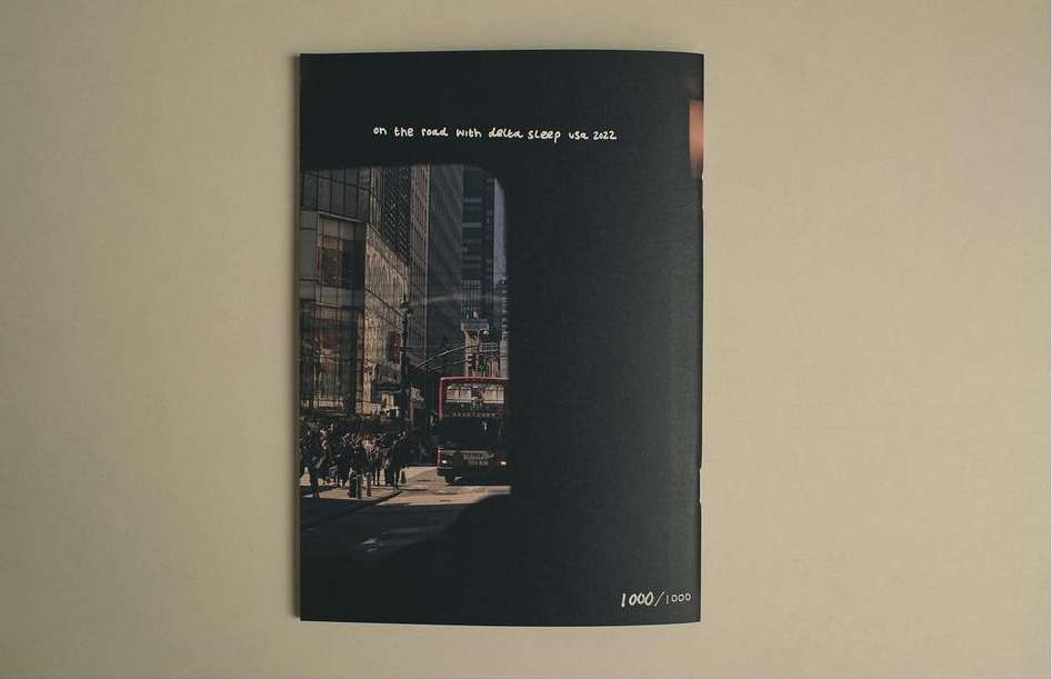 Book cover featuring a city street scene with a bus and pedestrians, set against a dark background with title text.