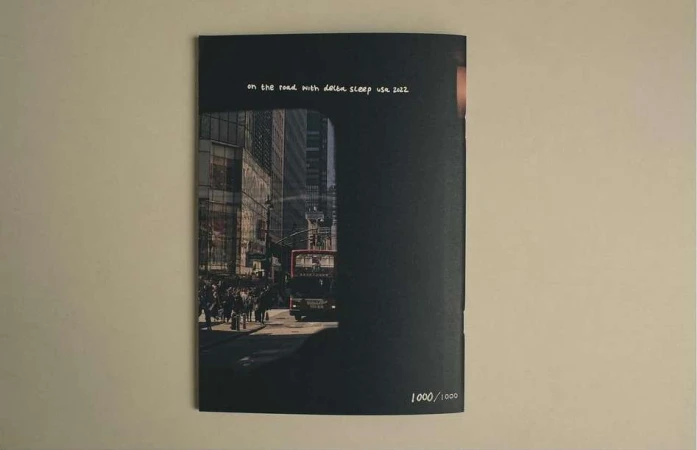 Book cover featuring a city street scene with a bus and pedestrians, set against a dark background with title text.