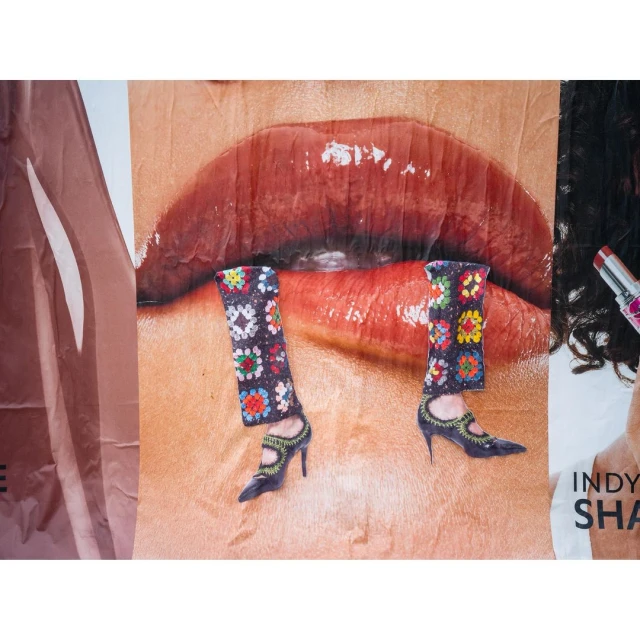 Surreal collage featuring a pair of lips wearing shoes with floral patterned leg coverings. Beauty and Fashion concept.
