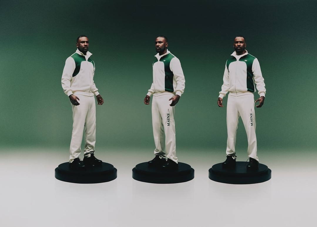 Three identical adult male figures wearing matching white and green tracksuits on pedestals, set against a graduated green backdrop.