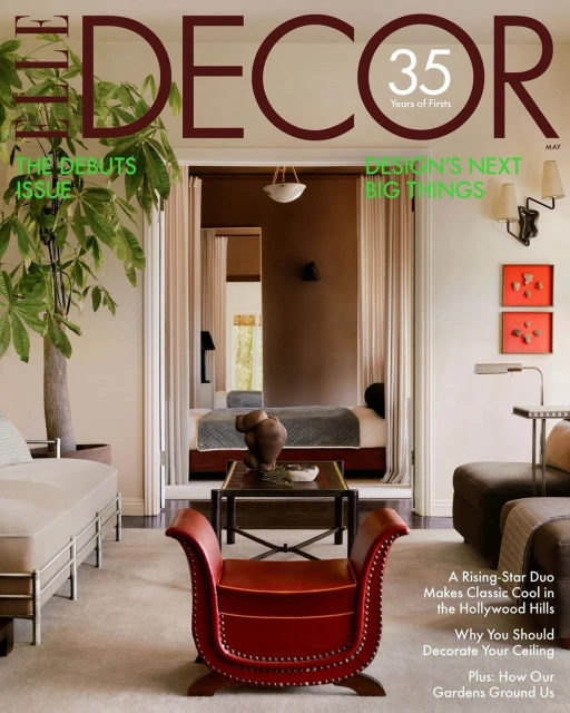 Elle Decor magazine cover featuring a curated living room with a bed visible in the background. Focus on interior design elements.
