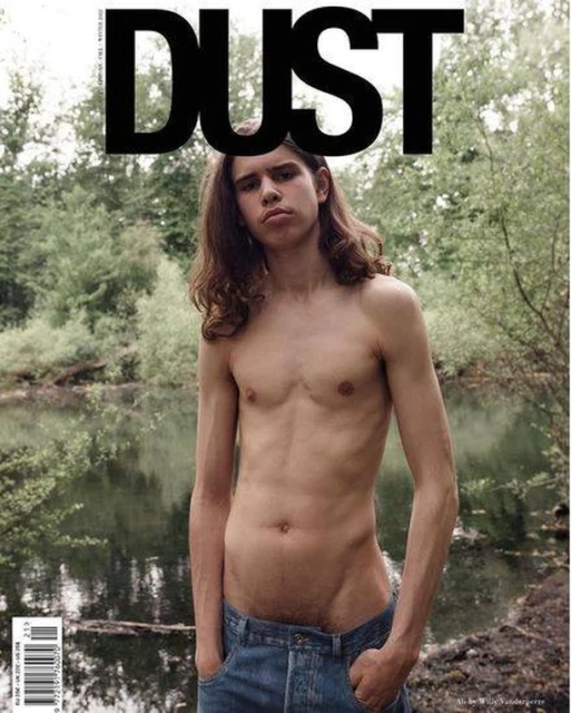 Magazine cover featuring a shirtless young man with long hair and jeans standing in a verdant, watery landscape under the DUST logo.