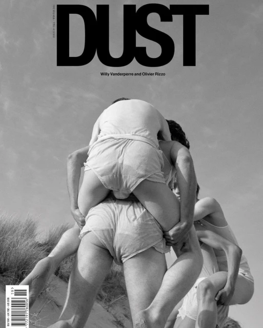 Black and white magazine cover shot featuring three young adult males in shorts, one standing with another riding piggyback, outdoors under sky.