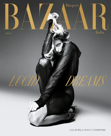 Harper's Bazaar Italia magazine cover featuring Anja Rubik in a sheer black outfit, kneeling against a gray backdrop with gold text overlay.