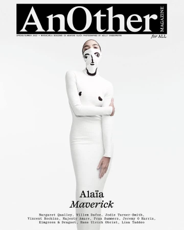 Magazine cover featuring a fashion model wearing a face covering and a white dress, against a light background, promoting Alaïa Maverick.