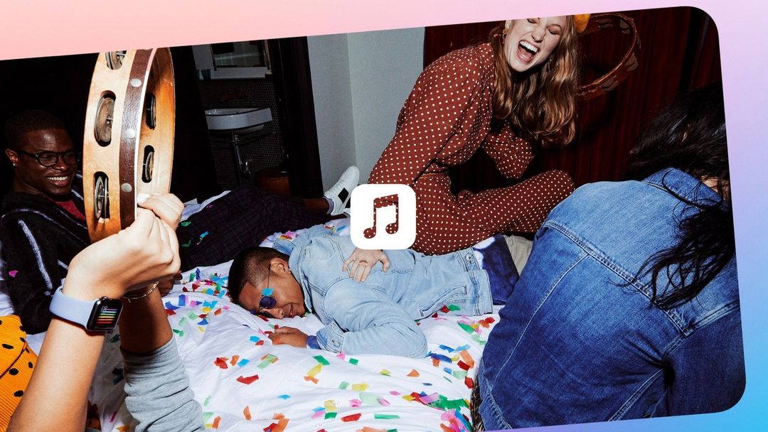 Group of young adults celebrate indoors, with one woman in polka-dot pajamas on a bed covered in confetti, another playing a tambourine.