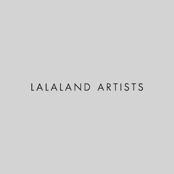 A text-based image featuring the words 'LALALAND ARTISTS' in simple, centered, black uppercase letters against a neutral gray background.