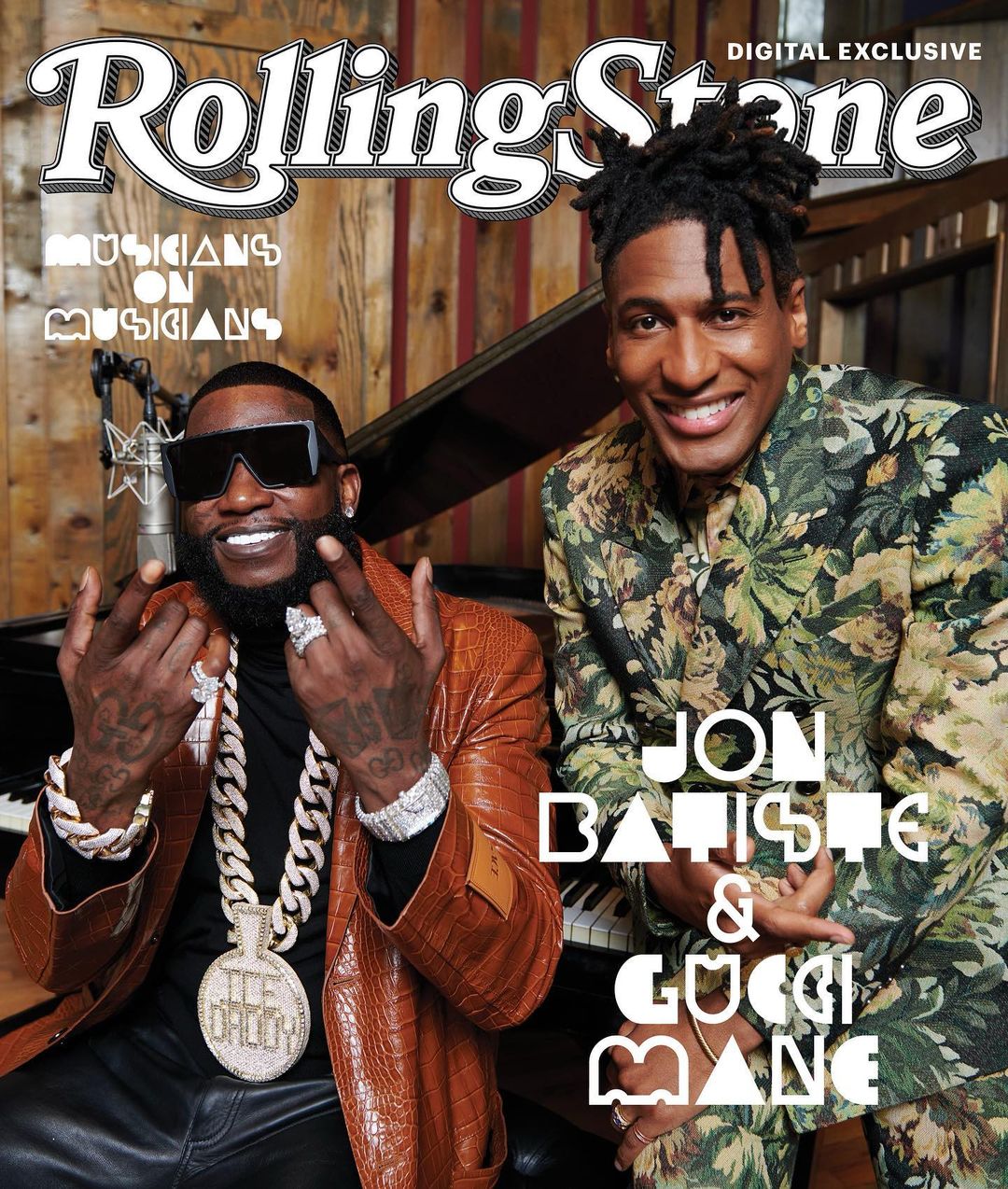 Rolling Stone magazine cover featuring Jon Batiste and Gucci Mane, posing indoors with a piano and wood wall backdrop.