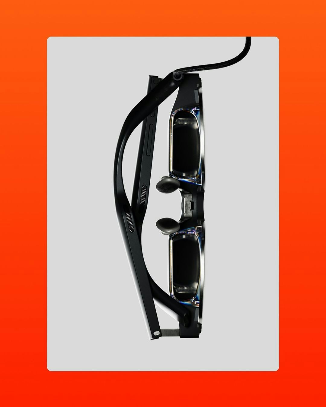 Close-up of black 3D glasses with a cord against a white background, set against an orange gradient background.