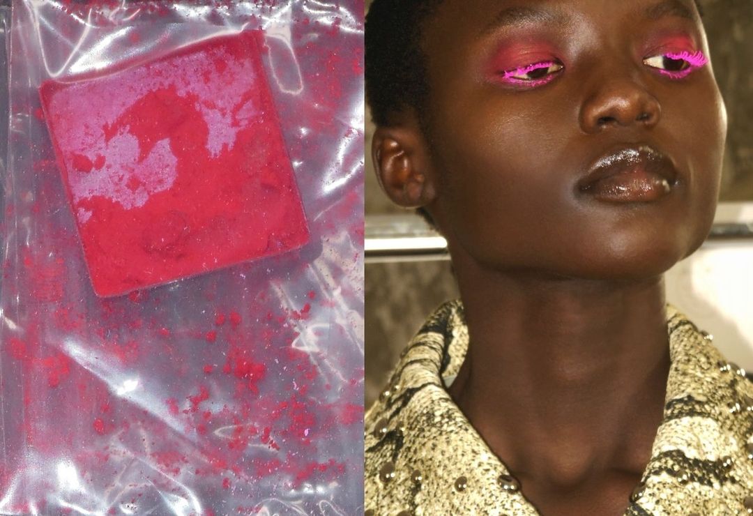 Close-up of a model's face with bright pink eyeliner, juxtaposed with a bag of red powder. Beauty and fashion concept.