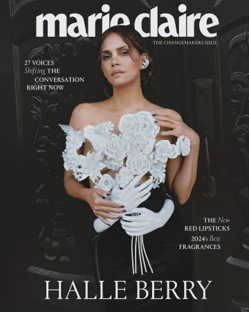 Marie Claire magazine cover featuring Halle Berry in white floral dress, photographed in a medium shot in front of a dark, carved door.