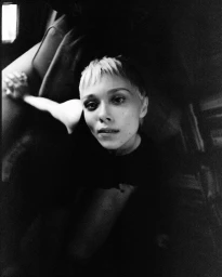 Monochrome portrait of a woman with short hair looking upward, captured by photographer Yana Yatsuk in New York.