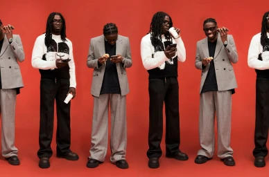 Multiple sequential poses of black men in patterned sweaters and grey blazers against a red background.