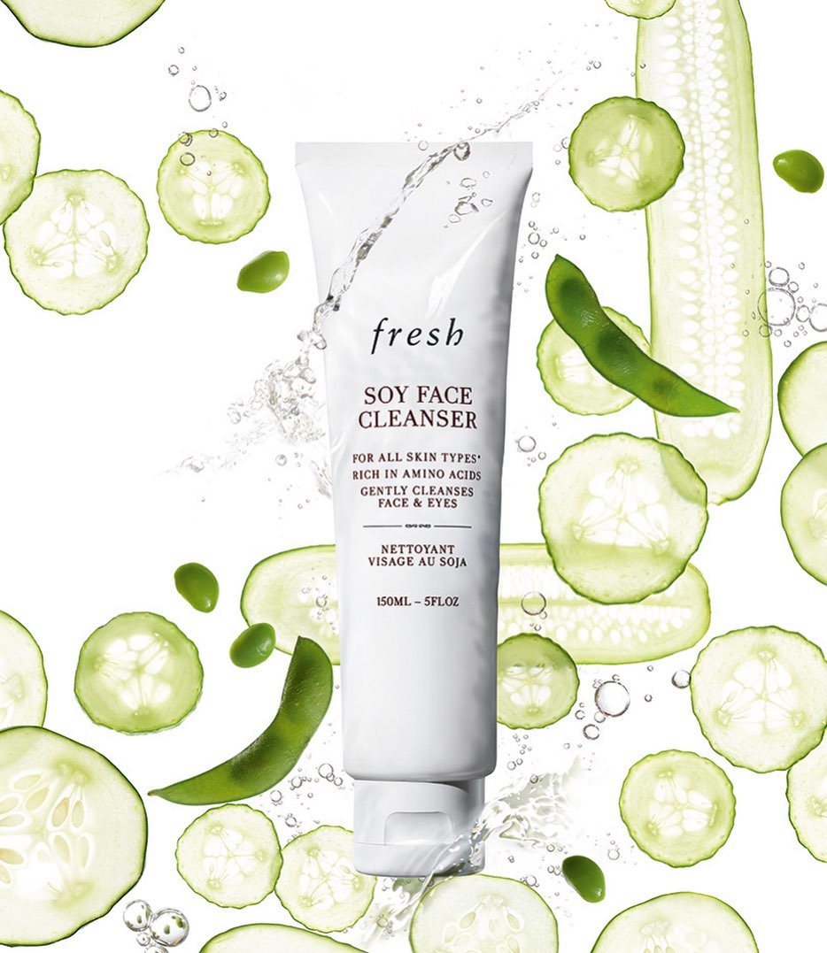 Fresh Soy Face Cleanser in white tube with cucumber and edamame slices. Cosmetic beauty product for skincare on white background.