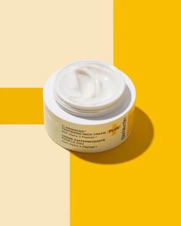 StriVectin TL Advanced Tightening Neck Cream PLUS jar on a yellow and cream-colored background. Focus on skincare and beauty.