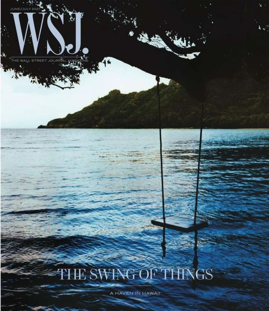 Magazine cover featuring a swing hanging from a tree over the ocean in Hawaii, with lush green island in the background and WSJ logo.