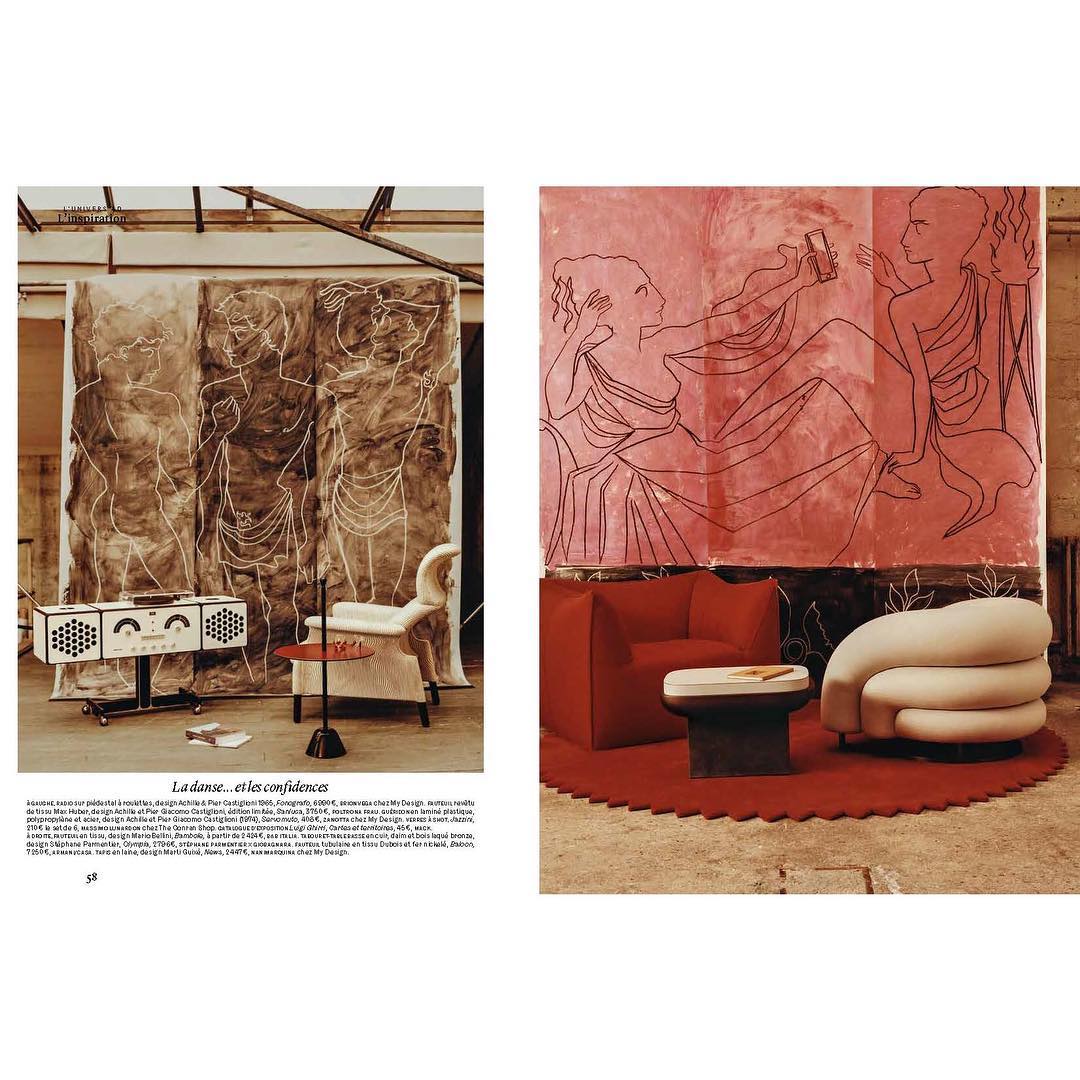 Interior scene featuring modern furniture, including sofas and a table, alongside abstract art panels and radio equipment in a studio.
