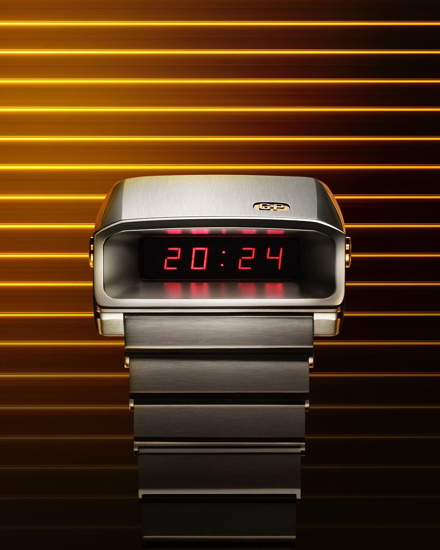 Close-up of a silver-tone digital wristwatch with a red LED display showing 20:24, against a horizontally striped yellow and brown background.
