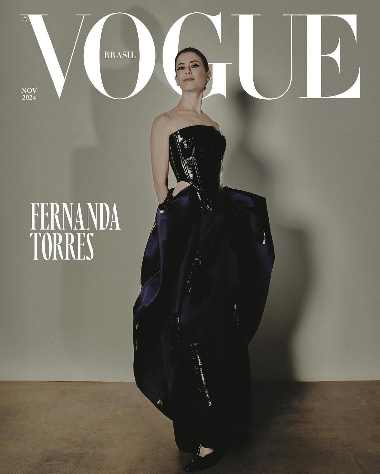 Vogue Brasil cover featuring Fernanda Torres in a dramatic black corset gown, against a muted gray background, fashion editorial.
