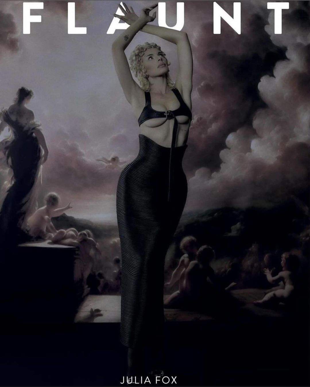 Julia Fox poses in black corset-like dress with an ornate background of a vintage landscape painting; fashion editorial cover.