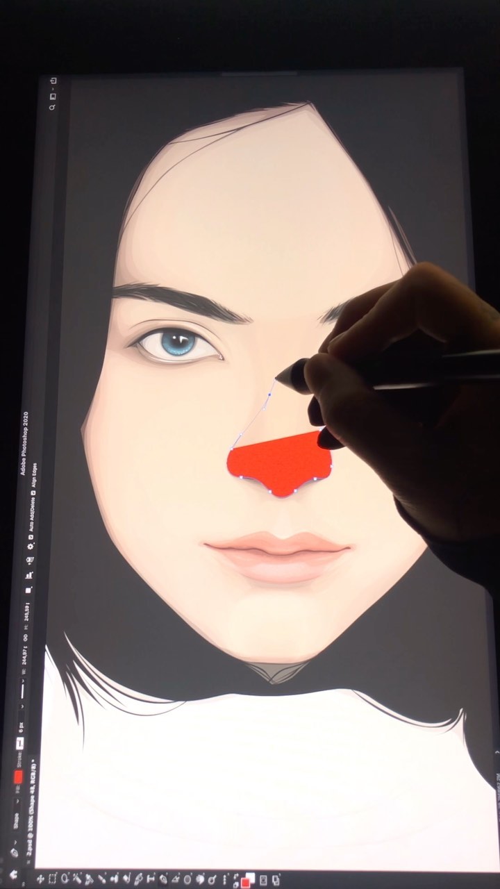 Close-up of an illustration of a woman's face in progress on a screen with a stylus drawing a red shape on the nose.