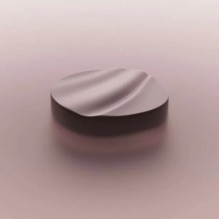 A round platform with a wave-like texture sits on a soft pink background, perfect for showcasing beauty or cosmetic products.