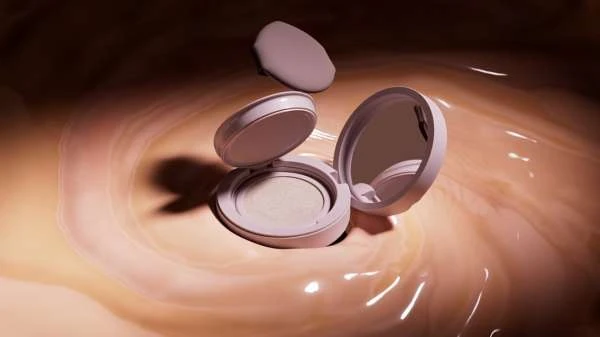 A close-up studio shot highlights a round, light pink makeup compact with an open lid, along with a soft applicator sponge. Beauty focus.