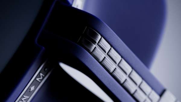Close-up of geometric metallic and blue structure showcasing detailed textures, possibly part of an industrial design element or decorative piece.