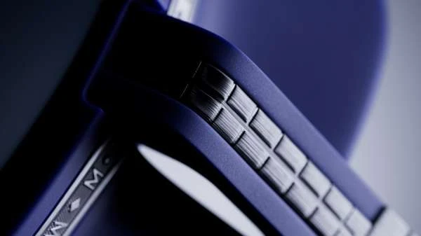 Close-up of geometric metallic and blue structure showcasing detailed textures, possibly part of an industrial design element or decorative piece.