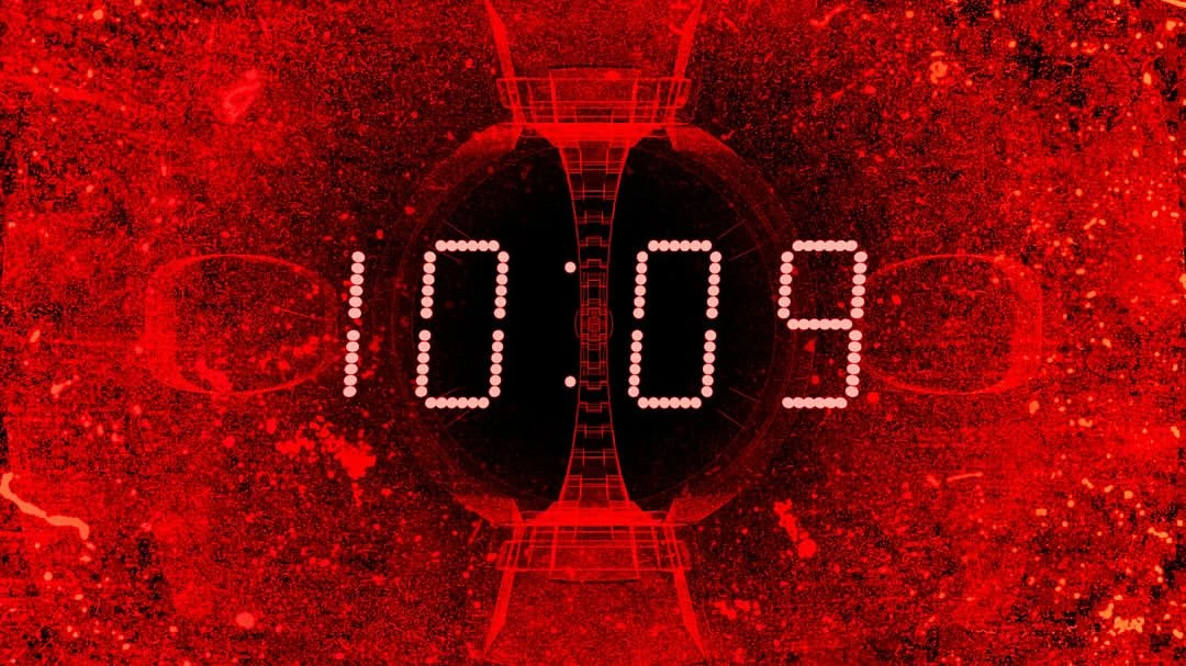 Digital display showing 10:09 in bright white against a red and black abstract background with geometric shapes.