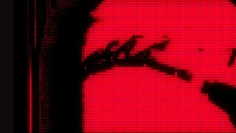 Abstract digital display with geometric patterns and bold red and black color scheme, creating a visually striking and modern aesthetic.