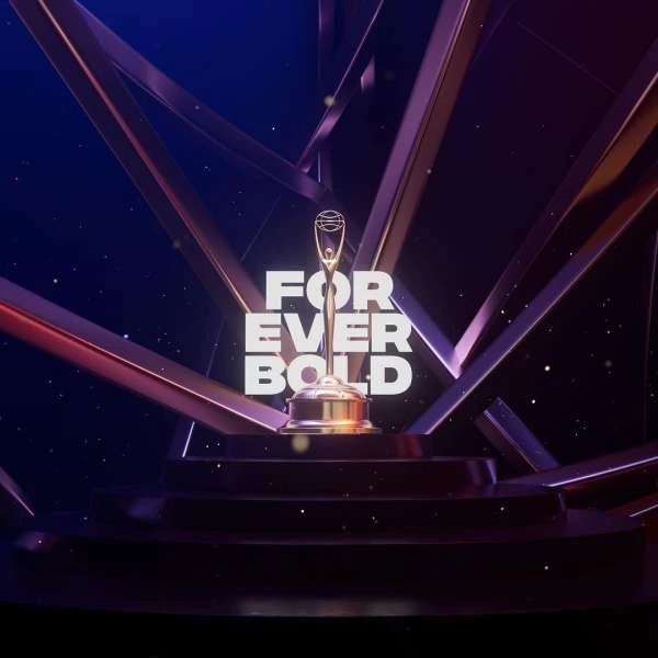 Golden trophy on a pedestal with a geometric background and the text 'Forever Bold' in white. Award ceremony promotional graphic.