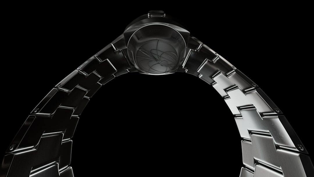 Close-up of a sleek, metal wristwatch with a distinctive band, set against a stark black background that highlights its intricate design.