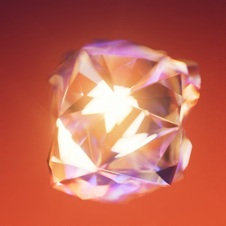 Close-up of a multifaceted diamond gemstone with an orange hue, featuring intricate light refraction and a glowing center, set against an orange background.