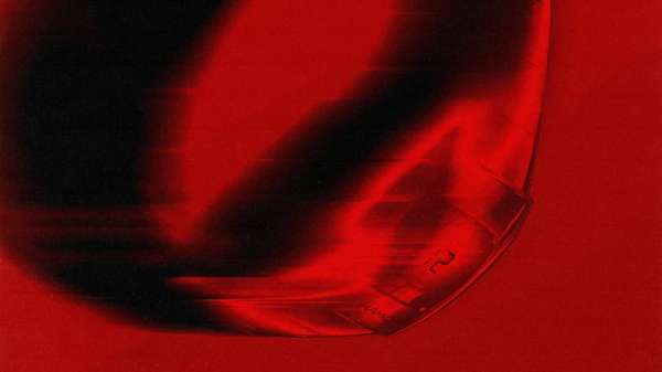 Abstract art featuring bold shades of red and black, creating a high-contrast, visually striking composition.