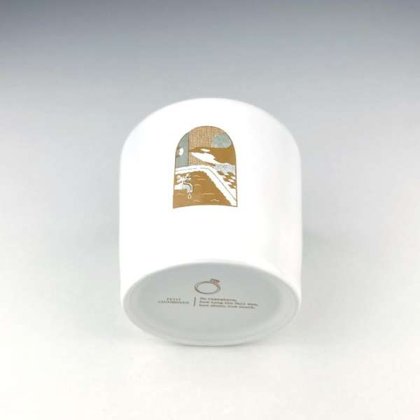 White cylindrical container with a landscape illustration and text at the bottom, set against a plain white backdrop.
