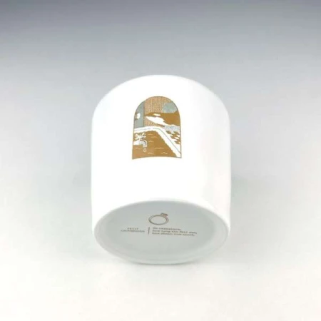 White cylindrical container with a landscape illustration and text at the bottom, set against a plain white backdrop.