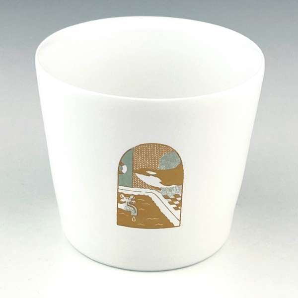 White ceramic cup featuring a graphic illustration with a faucet and pool under a cloudy sky, set against a neutral background.