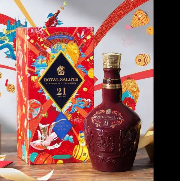 Royal Salute blended Scotch whiskey bottle and gift box in studio setting with traditional Asian design elements for product presentation.