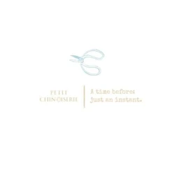 Minimalist digital illustration of a pair of light blue scissors with the text Petit Chinoiserie and A time before: just an instant.
