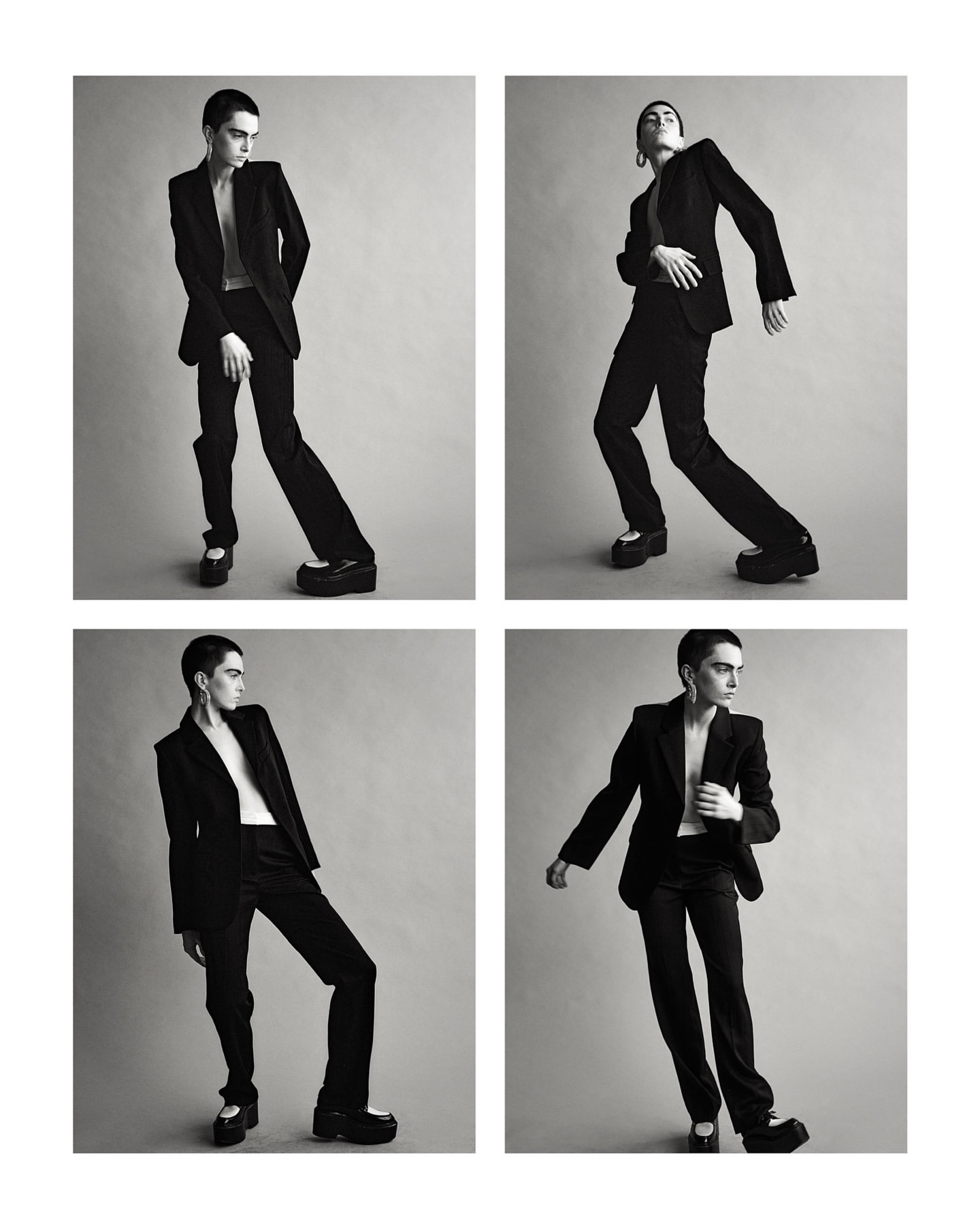 Monochrome studio shot of a non-binary model in a black suit with platform shoes, shown in a grid of four poses against a grey backdrop.