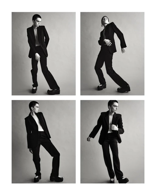 Monochrome studio shot of a non-binary model in a black suit with platform shoes, shown in a grid of four poses against a grey backdrop.