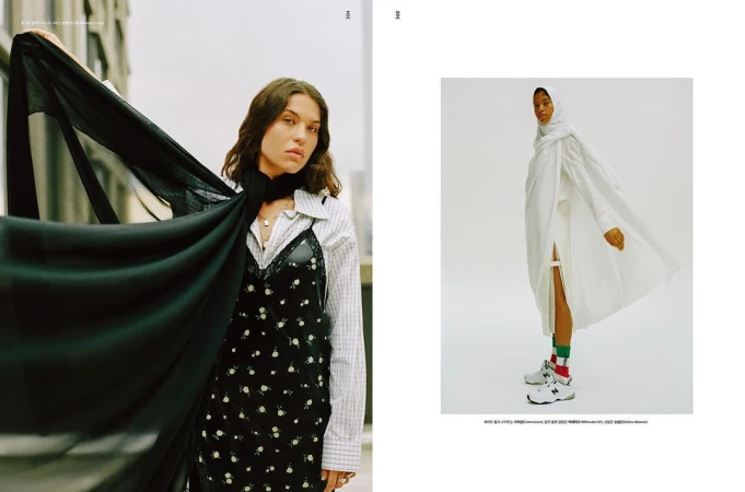 Editorial spread featuring two women, one holding a dark flowing fabric and another in a white outfit with trainers.