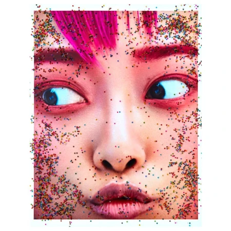 Close-up portrait of a woman with vibrant pink hair framed by scattered colorful confetti against a white background.
