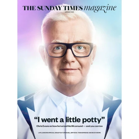 Magazine cover featuring Chris Evans in a close-up shot, wearing glasses and a white shirt, against a light blue and purple background.